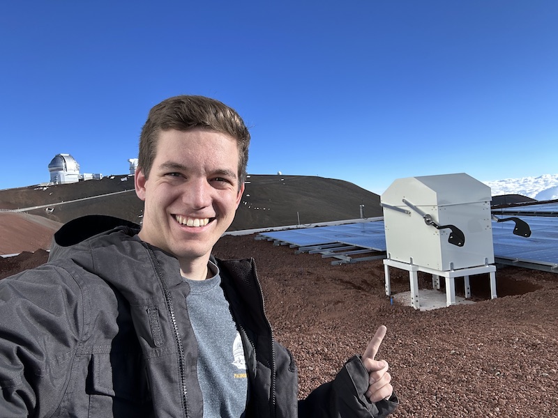 Me, pointing at my PhD thesis instrument, the
                                    Solar Calibrator (SoCal).